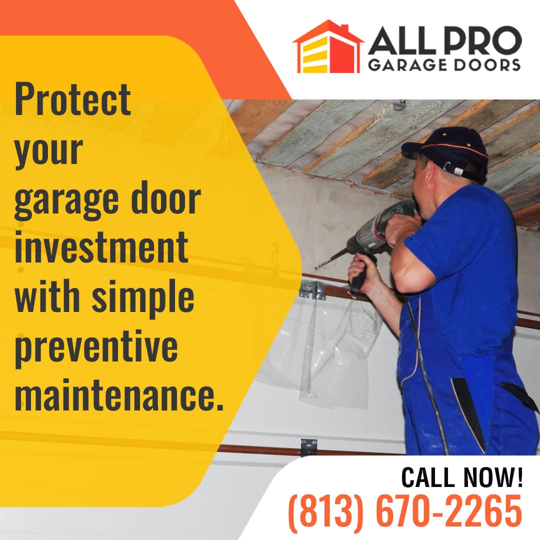 Technician performing preventive garage door maintenance inside a residential garage for All Pro Garage Doors